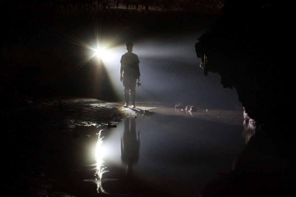 person in silhouette in Shannon County Missouri cave