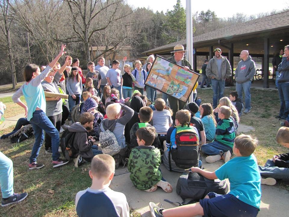 Ozark National Scenic Riverways official talking with children