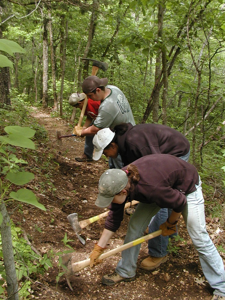 volunteers working on Cave Spring trail